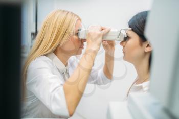Eyesight test in optician cabinet, diagnostic of vision, professional choice of glasses. Patient and doctor, consultation with specialist, ophthalmology