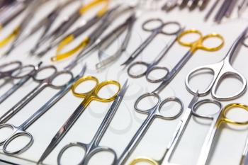 Medicine equipment, scissors, dental surgery instrument macro view. Dentist cabinet, stomatology. Tooth care, mouth hygiene