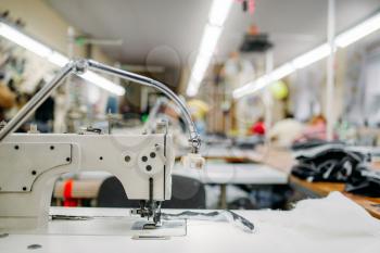 Sewing machine on clothing fabric, nobody. Dressmaking industry, Equipment on dress factory, professional tailoring