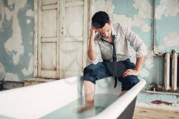 Businessman bankrupt in bathtub, suicide man concept. Problem in business, stress