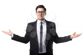 Successful businessman in tie and black suit spreads his hands to the sides, isolated on white background