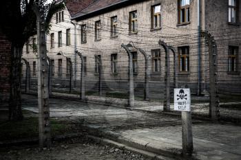 Barrack and barbed wire fence, German prison Auschwitz II, Birkenau, Poland. Museum of victims of the nazi genocide of the Jewish people