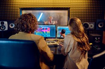 Musicians at mixing console, recording studio interior on background. Synthesizer and audio mixer, musician workplace, creative process, song record