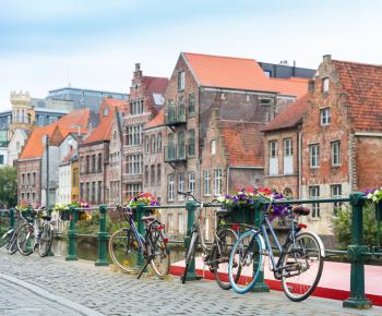 Bicycles and ancient building facade, old European town. Summer tourism and travels, famous europe landmark, popular places
