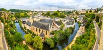 Luxembourg cityscape, ancient church on river, panorama. Old european architecture, medieval stone buildings, benelux country