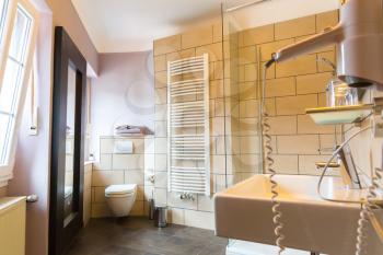 Hotel bathroom interior, bath, Europe tourism. European motel furniture for personal hygiene, apartment for comfortable leisure, nobody