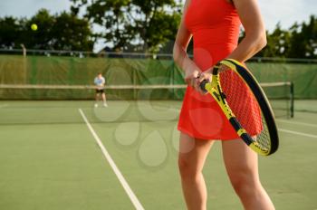 Tennis players with rackets, training on outdoor court. Active healthy lifestyle, people play sport game, fitness workout