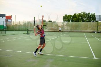 Male tennis players with rackets, training on outdoor court. Active healthy lifestyle, people play sport game, fitness workout with racquets