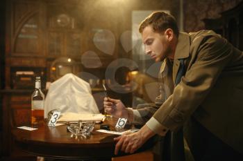 Male detective with tweezers puts the evidence in a bag at the crime scene, retro style. Criminal investigation, inspector is working on a murder, vintage room interior on background