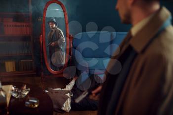 Male detective with gun standing at the mirror, crime scene, retro style. Criminal investigation, inspector is working on a murder, vintage room interior on background