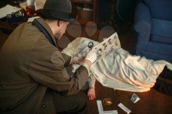 Male detective with magnifying glass looking killer's letter, evidence at the crime scene, retro style. Criminal investigation, inspector is working on a murder, vintage room interior on background