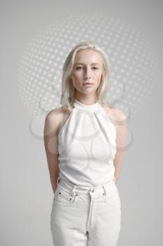 Futuristic young woman in white clothes, light grey background. Female person in virtual reality style, future technology, futurism concept