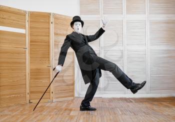 Male mime artist, gentleman with the cane. Pantomime theater, parody comedian, positive emotion, humour performance, funny face mimic and grimace