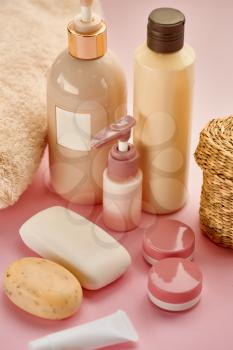 Skin care products on pink background, nobody. Healthcare procedures concept, hygiene cosmetic, healthy lifestyle, spa