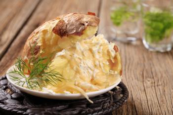 Baked potato with two kinds of cheese