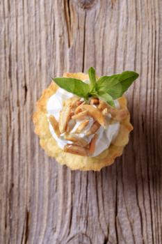 Canape - Pastry base with savory spread topping and roasted almonds