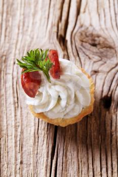 Canape - Pastry base with savory spread topping and salami