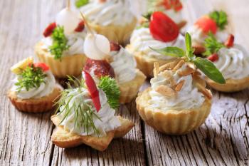 Variety of pastry-based canapes with various toppings