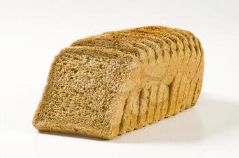 Sliced loaf of brown sandwich bread
