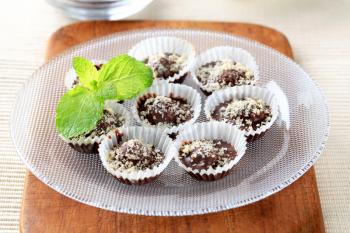 Chocolate and nut treats in small paper cups
