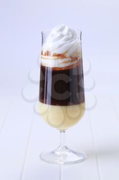 Glass of liqueur coffee with whipped cream 