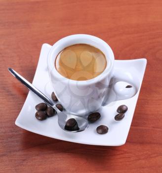 Cup of espresso with golden brown foam