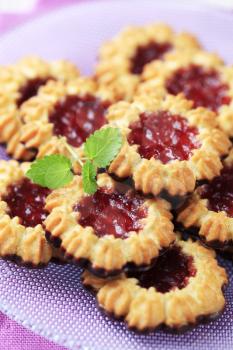 Chocolate dipped butter cookies with jelly center