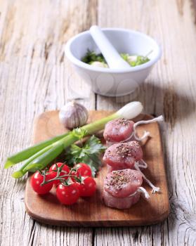 Raw pork tenderloin and fresh vegetables - still life