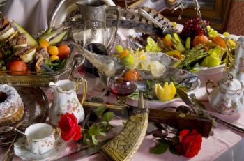 Still life of antique tableware and food