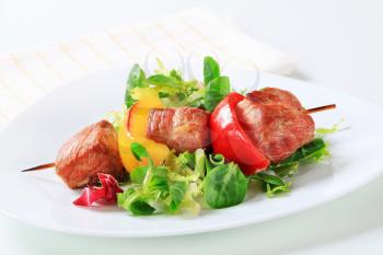 Grilled pork skewer with spring salad
