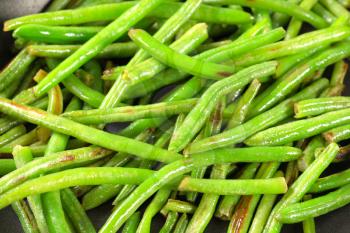Green beans on a frying pan