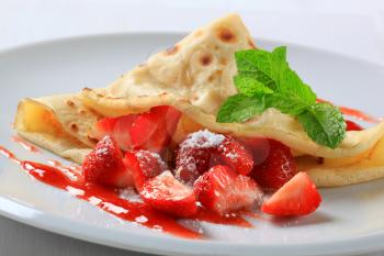 Crepe with fresh strawberries and coulis