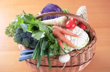Variety of fresh vegetables in a wicker basket