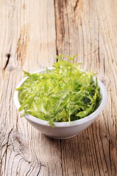 Bowl of fresh salad greens - closeup