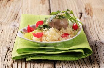 Couscous, button mushroom with pesto and fresh vegetables