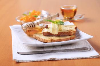 Breakfast - Toasted bread, butter, honey and marmalade