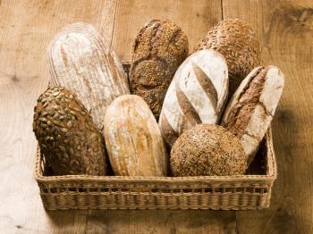 Assorted loaves of bread in a wicker basket
