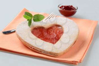 Heart shaped shortbread cookie with jam filling