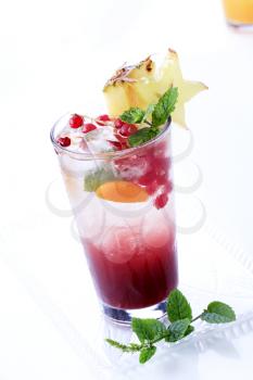 Glass of iced drinks garnished with fruit