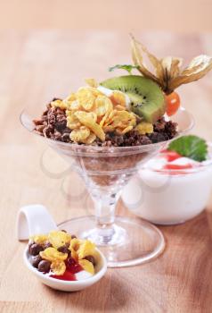 Various types of breakfast cereal and yogurt