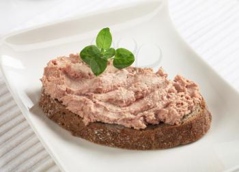 Slice of whole wheat bread and pate