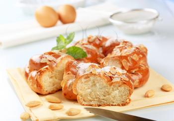 Sweet braided bread wreath topped with almonds