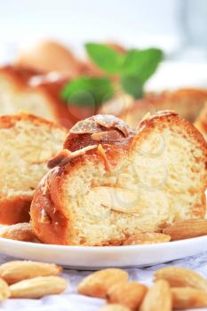 Slices of sweet bread and blanched almonds