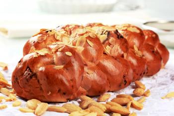 Sweet braided bread with almonds and raisins