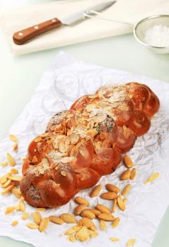 Sweet braided bread with almonds and raisins