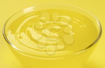 Bowl of yellow gelatin dessert
 - detail