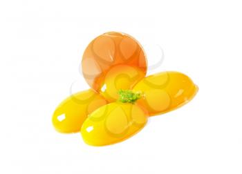 Four fresh egg yolks and eggshell