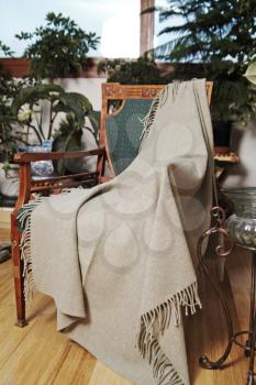 Throw draped over an antique chair
