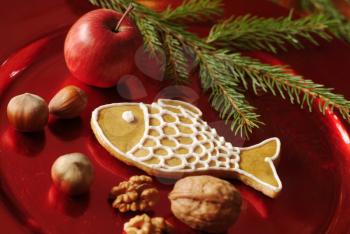 Christmas still life - Gingerbread cookie, nuts and red apple