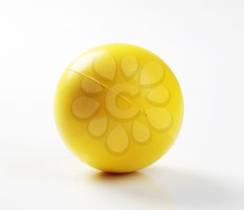 Closeup of a yellow foam ball - studio